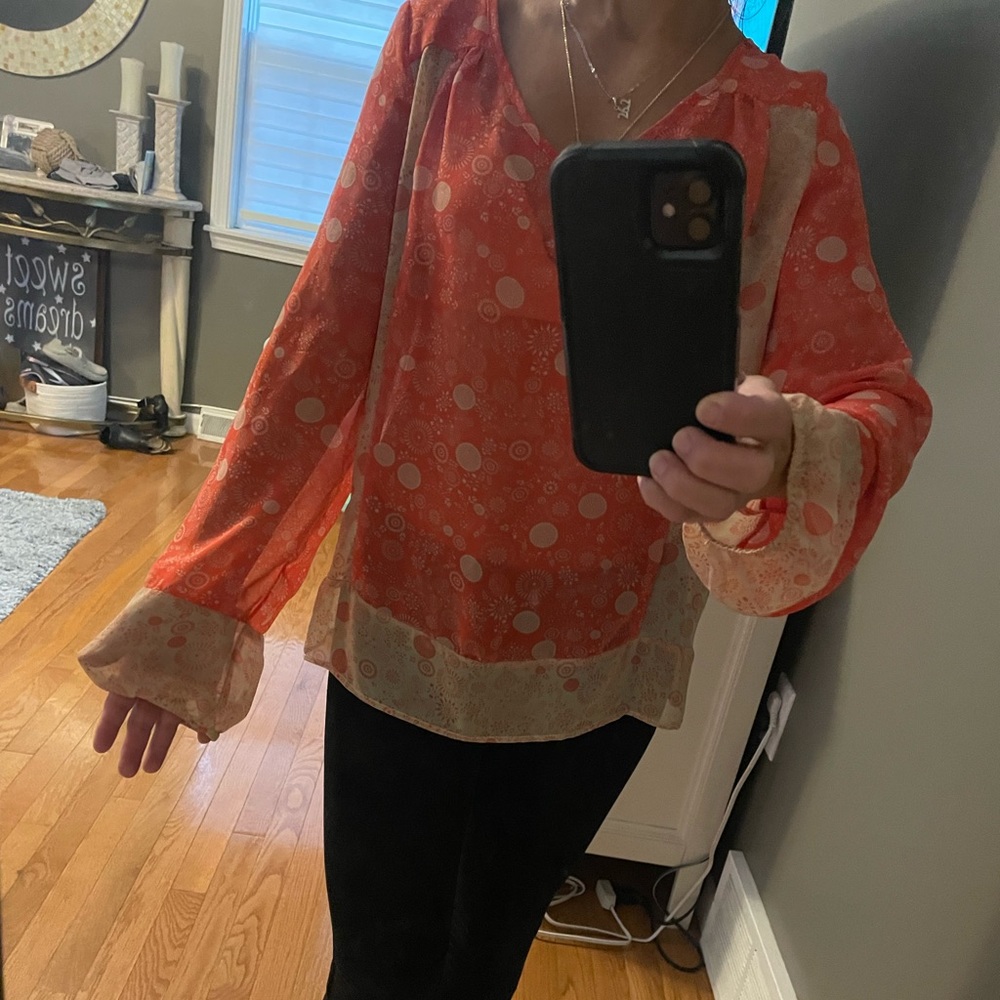 Bought at a boutique shop for my daughter!  Beautiful colorful blouse